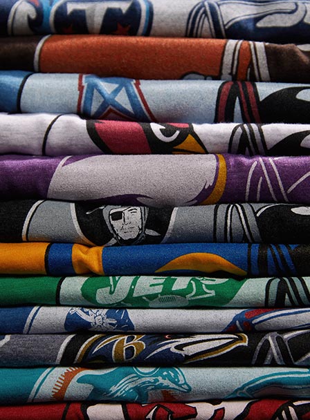 New York Jets Gotham City Football T-Shirt from Homage. | Officially Licensed Vintage NFL Apparel from Homage Pro Shop.