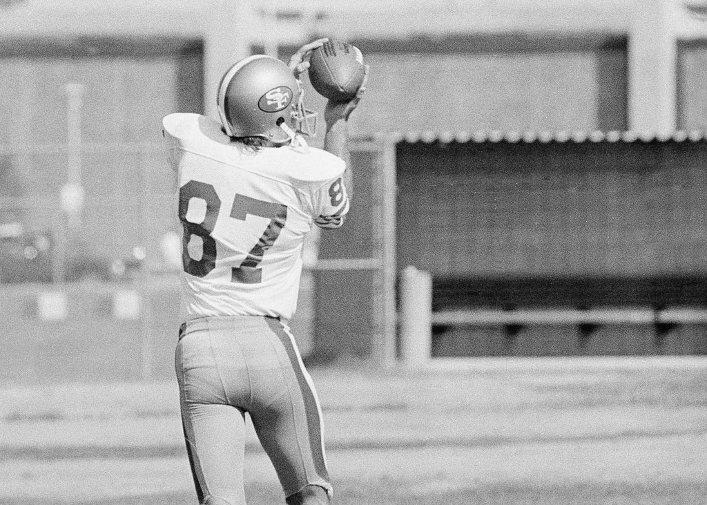 Dwight Clark (87), San Francisco 49ers' ace pass catcher, pulled one in over his shoulder during practice at their training camp. (AP Photo/Walt Zeboski)