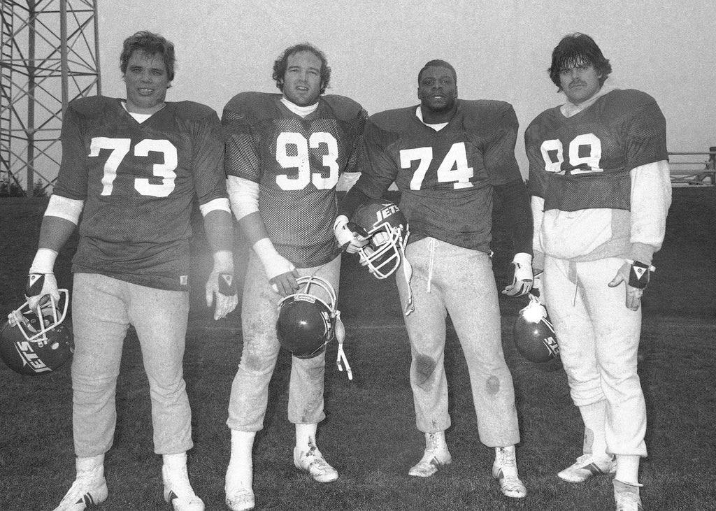 The New York Jets "Sack Exchange", from left, defensive end Joe Klecko, defensive tackles Marty Lyons and Abdul Salaam, and defensive end Mark Gastineau, stand during a team practice.  (AP Photo/Kathryn Dudek)