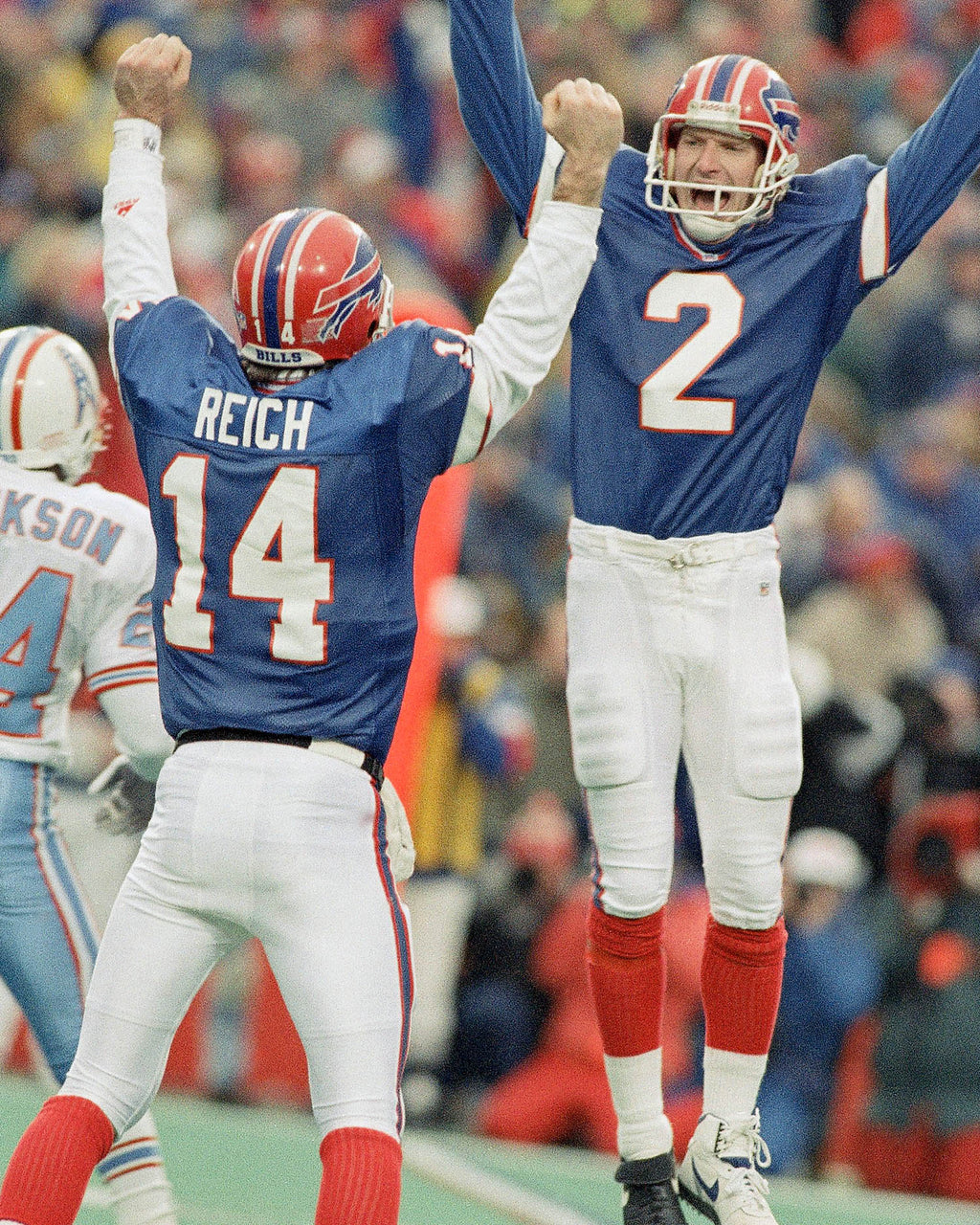 Buffalo Bills kicker Steve Christie, right, celebrates his game-winning field goal with quarterback Frank Reich as the Bills beat the Houston Oilers in overtime 41-38 on Jan. 3, 1993 in Orchard Park. (AP Photo/John Hickey)
