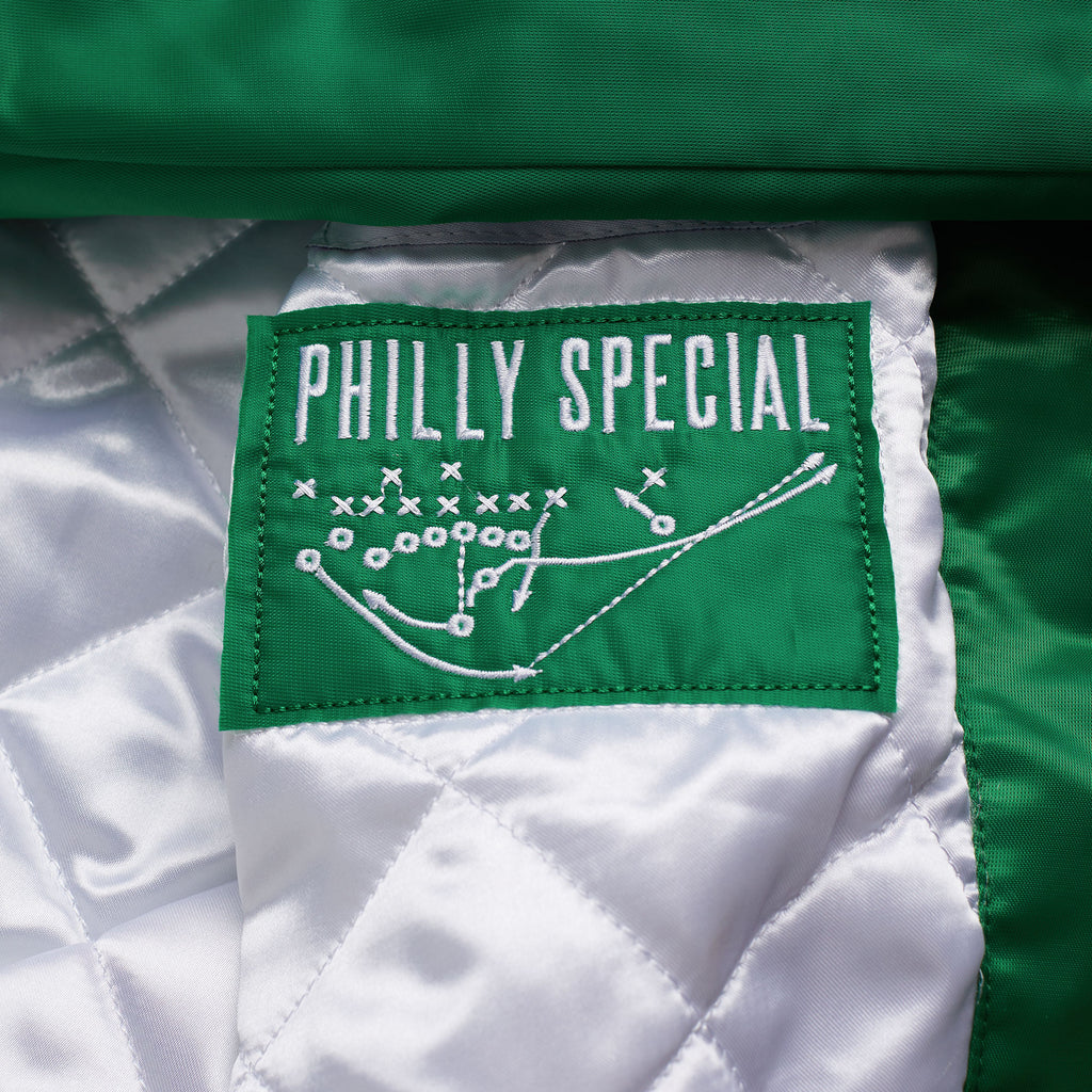 Our exclusive, vintage-inspired Philadelphia Eagles HOMAGE x Starter Satin Jacket is built for the sidelines, with all the classic details of the original: full-snap buttons, slip pockets, quilted lining, and the essential interior patch featuring The Philly Special.